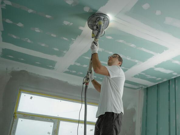 A man repairs a ceiling