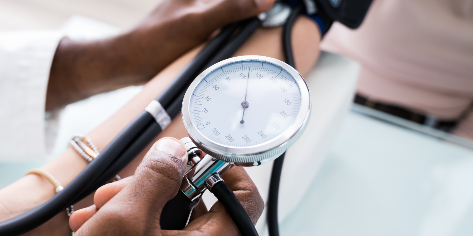 Close-up of a doctor checking a patient's blood pressure