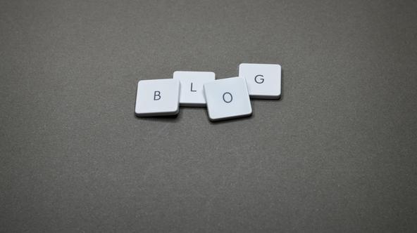 B L O & G keycaps of a keyword lying on a grey surface spelling out 'blog'