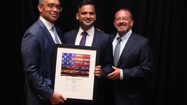 Vikram Swaruup (center) with Karl Racine (left) and Raul Fernandez (right)