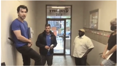 Screenshot of a video shows landlord Sam Razjooyan (left), Jesper Nylen, and Richard Cunningham meeting with tenants at 1717 17th St. NW. 