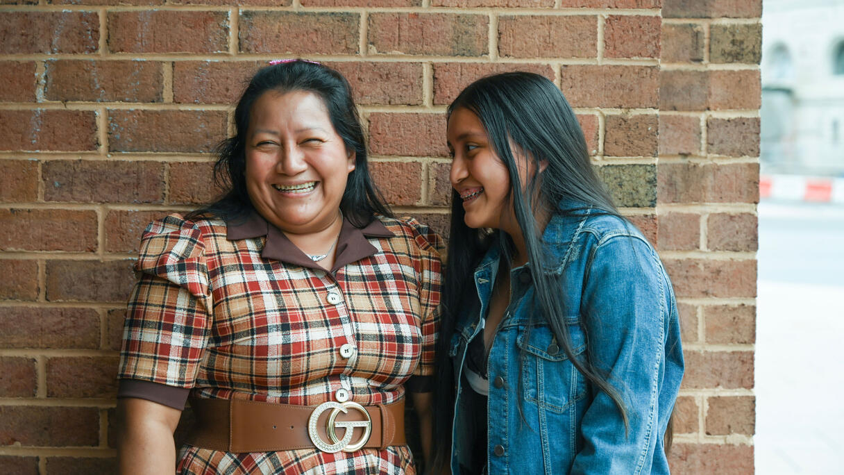Legal Aid client laughing with her daughter