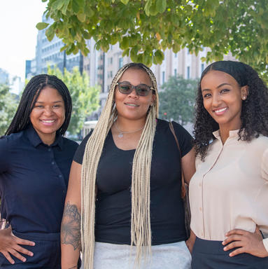 Former client Shanita Womack (c) with attorneys Zenia Laws (l) and Sudi Tasissa (r)