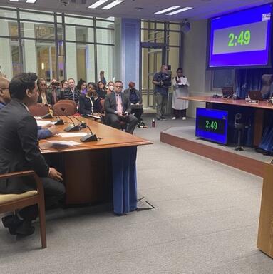 Vikram Swaruup testifying at a DC Council hearing led by Brooke Pinto
