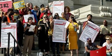 A rally on the steps of the Wilson Building