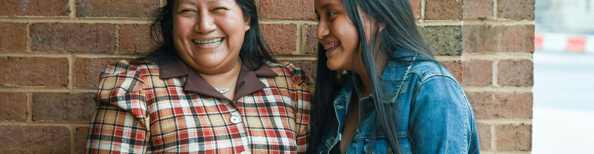 Legal Aid client laughing with her daughter
