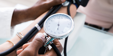 Close-up of a doctor checking a patient's blood pressure